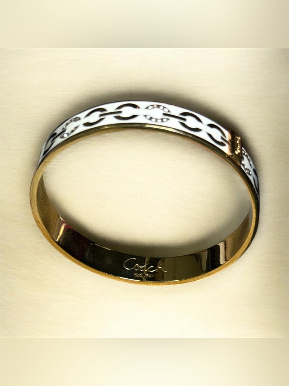 Coach Signature Enamel and Crystal Bangle Bracelet.